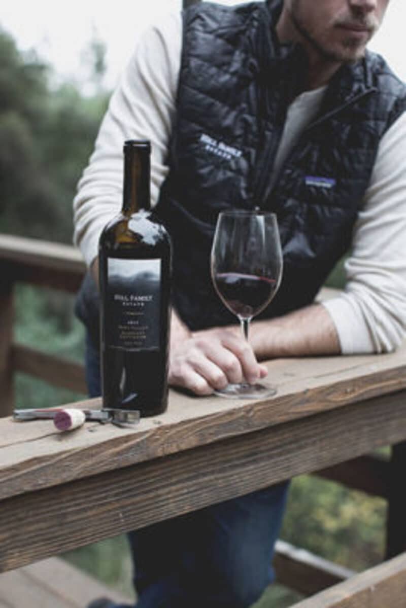 man with wine bottle