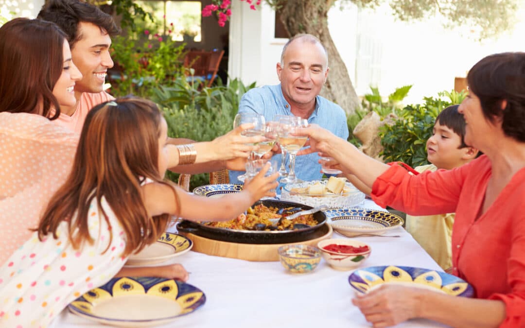 family cheering around table