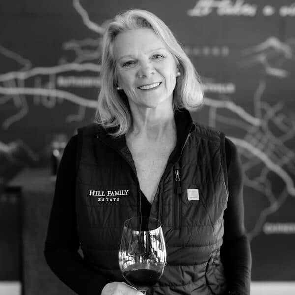 Kari headshot holding wine glass