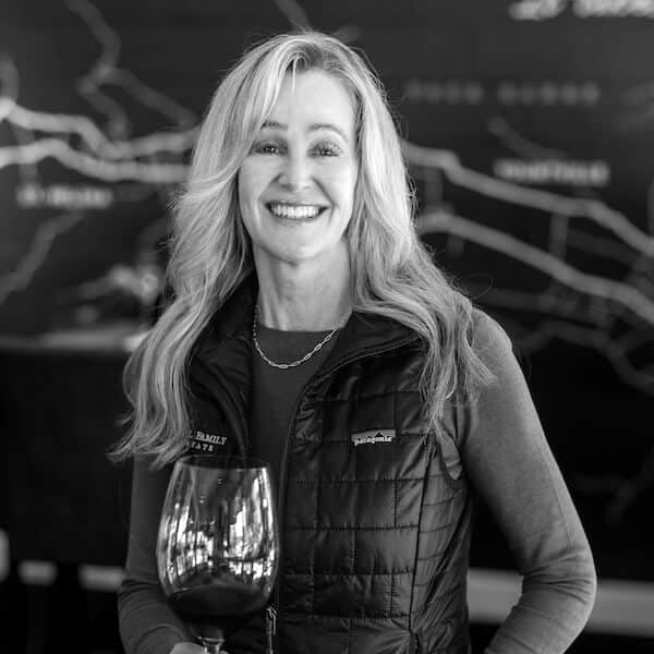 shelley henry headshot, holding glass of wine