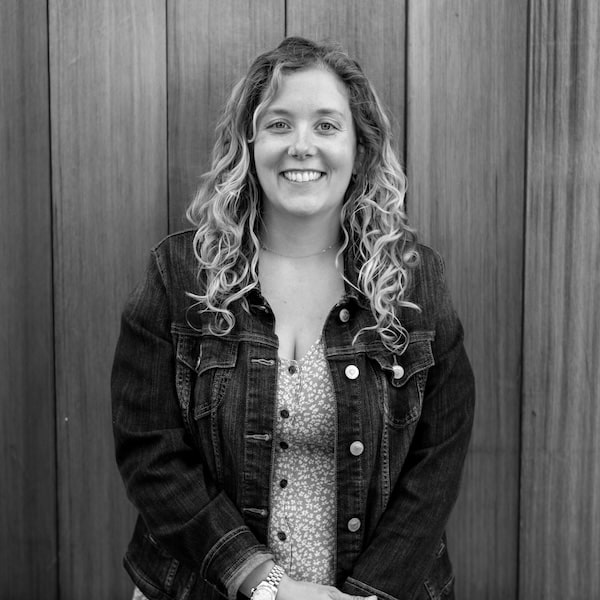 kaitlynn smiling wearing flower dress and jean jacket